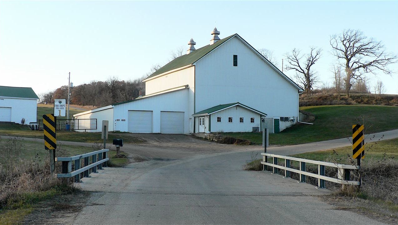 The empty dairy barn today. Note the additions. Hefty Creek is in the foreground.
