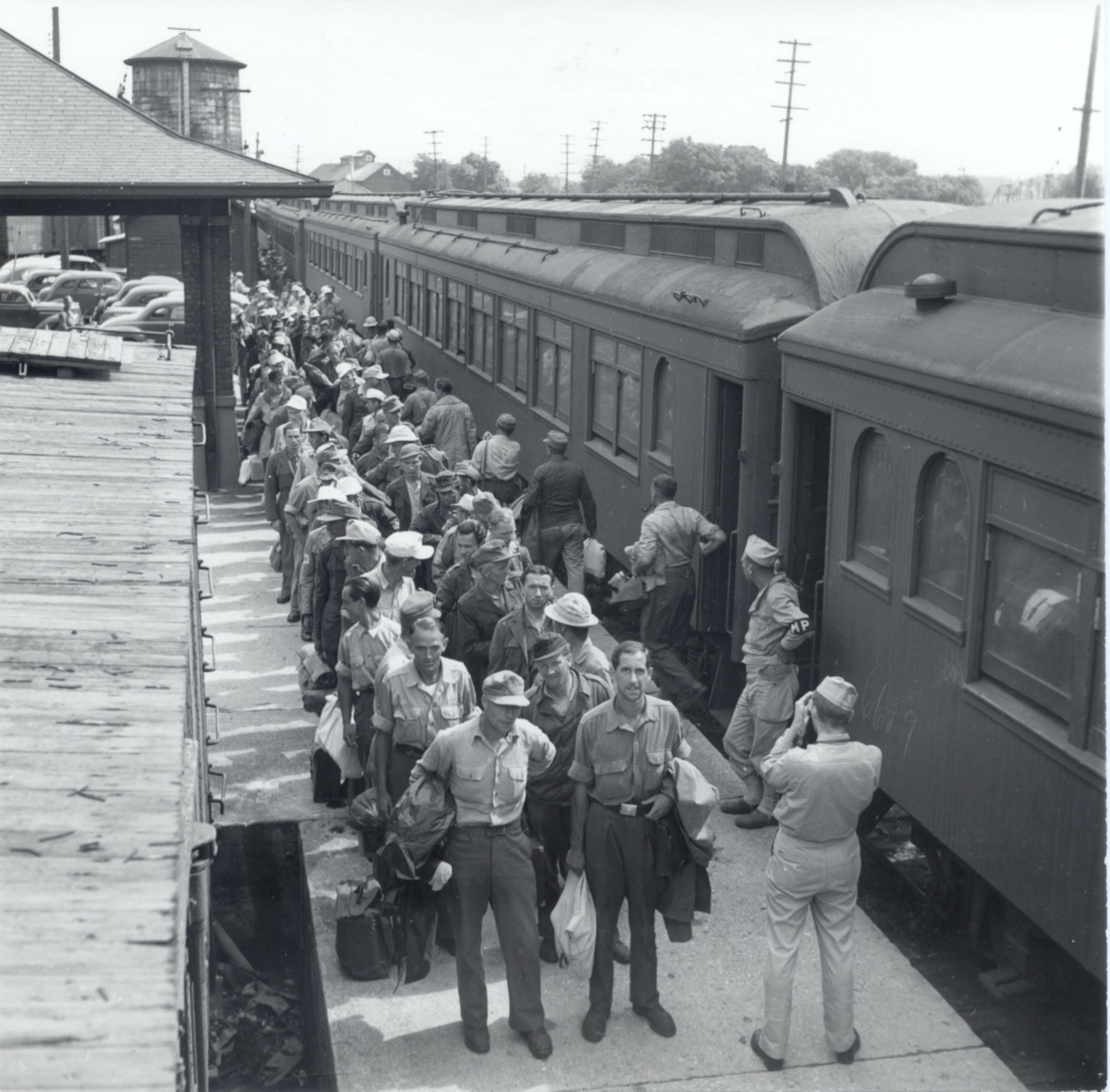 German POWs arrive by train to work in Door County orchards and canneries during World War II.
