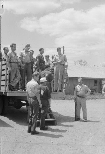 German POWs are being loaded into a truck in Columbus to go to work at a canning company.