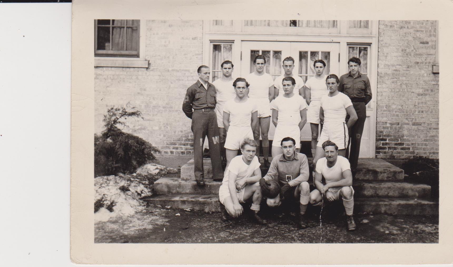 During his time at Camp Hartford, Kurt Pechmann was part of a soccer team. In this photo from January 1945, the soccer team is pictured, with Pechmann seen on the left side of the middle row.